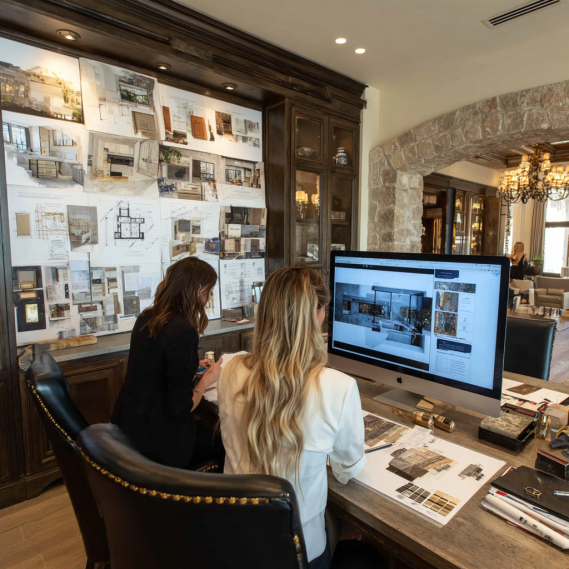 Interior designers presenting custom home design mood boards to a client in California